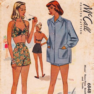 May include: A vintage McCall's 6848 printed pattern envelope featuring illustrations of beachwear. The design includes a floral print halter top and shorts, a solid blue button-down shirt with pockets, and dark shorts, all displayed on a beach background.