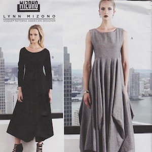 May include: A Vogue Patterns sewing pattern envelope by Lynn Mizono featuring two dress designs. View A is a sleeveless grey dress with a fitted bodice and a full, pleated skirt. View B is a long-sleeved black dress with a similar silhouette.