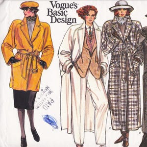 May include: A Vogue's Basic Design sewing pattern illustration featuring three outfits: a yellow belted coat with a black skirt, a white long coat over a tan blazer and trousers, and a long plaid trench coat with a matching hat and scarf.