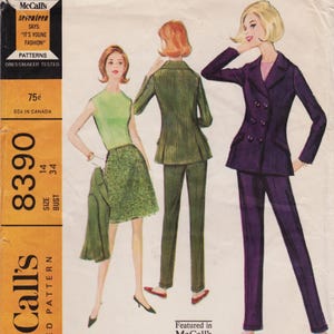 May include: A vintage McCall's sewing pattern envelope 8390 featuring illustrations of three outfits: a sleeveless green top with a textured skirt, a green jacket with matching trousers, and a dark purple double-breasted suit with trousers.