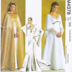 May include: A sewing pattern envelope labeled M4378, size GG (18-20-22-24), featuring illustrations and photographs of a floor-length white gown with gold trim and long flared sleeves, alongside a sheer gold hooded cape with gold embroidery.