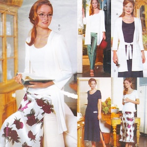 May include: A fashion collage showcasing several outfits. One ensemble features a white top, a long white cardigan, and a floral skirt with burgundy roses. Another outfit includes a navy blue dress. Other outfits include white tops and long cardigans.