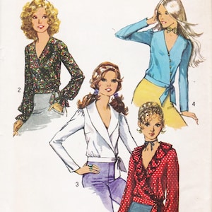 May include: A sewing pattern illustration featuring four long-sleeved tops. One is a dark floral wrap top, one is a light blue button-down with a tie waist, one is a white wrap top with a wide collar, and one is a red polka-dot top with ruffles.
