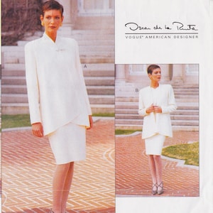 May include: A sewing pattern for a white suit jacket and skirt. The pattern is by Oscar de la Renta, Vogue American Designer. The pattern includes two views, A and B. View A is a longer jacket with a wrap-style front. View B is a shorter jacket with a more traditional style.