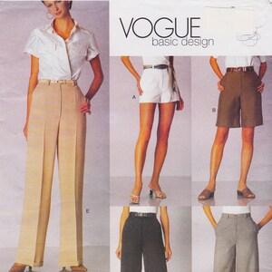 May include: Vogue Basic Design sewing pattern featuring various styles of women's pants and shorts. The image shows a woman wearing high-waisted, wide-leg pants and several other examples of shorts and pants.