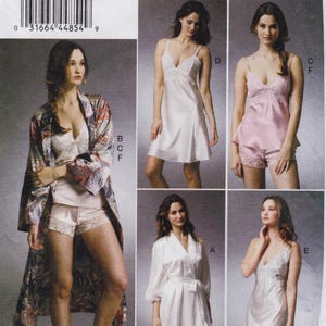May include: A sewing pattern envelope featuring illustrations of sleepwear including a paisley robe, a white camisole and shorts set, a pink camisole and shorts set, a white wrap robe, and a white slip dress with lace trim details.