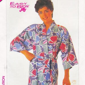 May include: A floral print robe with a matching belt. The robe features a pattern of red, blue, and gray flowers on a purple background. The text "E-A-S-Y TO SEW Jiffy" is visible in the upper left corner.