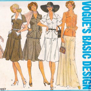 May include: Vintage Vogue Basic Design sewing pattern showing four illustrated women's outfits. The designs include skirt suits, a white suit with a wide-brimmed hat, and a long skirt with a button-up shirt. The pattern number is 1227.