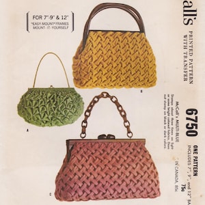 May include: A vintage McCall's 6750 sewing pattern sheet featuring three handbag designs: a green gathered pouch with a gold chain handle, a mustard yellow woven-texture bag with a dark handle, and a mauve woven-texture bag with a chain handle.