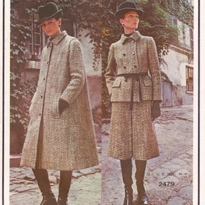 May include: Two models showcasing vintage tweed coats and suits. One wears a long coat, the other a suit with a skirt and belted jacket. Both outfits feature a herringbone pattern. The image includes the Givenchy logo and the number 2479.