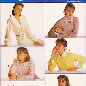 May include: Vogue Patterns Craft sewing pattern number 9953 for a blouse with different collar and cuff variations. The pattern includes five different styles of blouses with collars and cuffs, including a white blouse with a lace collar, a pink blouse with a lace collar, a yellow blouse with a white collar, a beige blouse with a white collar, and a white blouse with a lace collar and cuffs. The pattern is for one size.