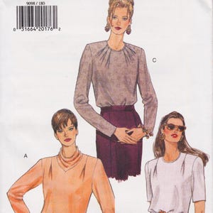 May include: A vintage sewing pattern featuring illustrations of women's blouses and a skirt. The pattern includes a variety of styles, with long and short sleeves, and different necklines. The color palette includes shades of peach, gray, and burgundy.
