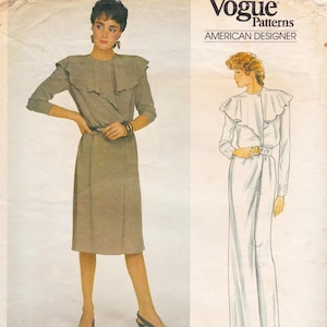 May include: A vintage Vogue Patterns sewing pattern featuring an American Designer design. The pattern shows a woman in a long-sleeved dress with a ruffled collar and a belt. The dress is a neutral color, and the pattern includes the Vogue logo.