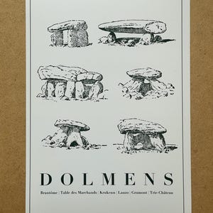 May include: A black and white print featuring six illustrations of dolmens, ancient stone structures. The word "DOLMENS" is printed in large capital letters at the bottom, with place names below. The print is on a white background.