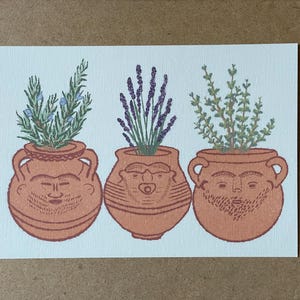 May include: A set of three ceramic mugs with a speckled, matte finish. Each mug is a different colour: light blue, cream, and grey. The mugs have a simple, modern design and a comfortable handle.