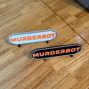 Murderbot Diaries Sign | Wall Adhesive and Stand | 7.5&quot;x2&quot; | Season 1 | 2 Available | Murderbot Gifts