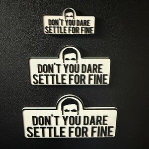 May include: Three white rectangular magnets with a black border and a black silhouette of a person's face. The magnets have the text "DON'T YOU DARE SETTLE FOR FINE" in black.