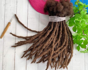 May include: A bundle of brown human hair dreadlocks, also known as faux locs, for hair extensions. The dreadlocks are arranged in a fan shape and are ready to be installed.