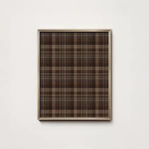 May include: A framed print featuring a brown plaid pattern. The plaid design incorporates various shades of brown, creating a classic and versatile aesthetic. The frame is a thin, gold color, adding a touch of elegance to the artwork.