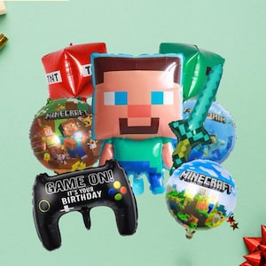 May include: A collection of Minecraft-themed balloons, including a Steve character, a green sword, and a black game controller with the text "Game On! It's Your Birthday." Other balloons feature the Minecraft logo and TNT.