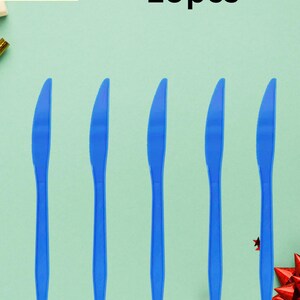 May include: A set of ten blue plastic knives. The image features five knives in the foreground, with the text "Plastic knife 10pcs" in black at the top. The logo for "Oddity Wonders" is in the top left corner.