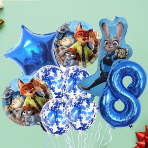 May include: A collection of Zootopia-themed party balloons. Includes a blue star, a number 8, and character-shaped balloons featuring Judy Hopps and Nick Wilde. Several round balloons have a white and blue confetti pattern.