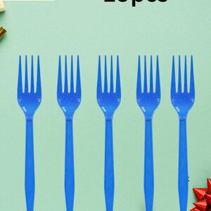 May include: Five blue plastic forks arranged in a row against a light green background. The text "Plastic fork 10pcs" is at the top. The forks are evenly spaced and have a simple, functional design.
