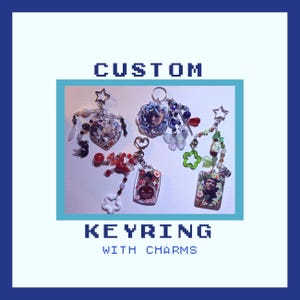 May include: Four custom keyrings featuring various charms, including heart-shaped, rectangular, and circular pendants with photographic inserts, colourful beads, star-shaped clips, and butterfly accents. The text CUSTOM KEYRING WITH CHARMS is visible.