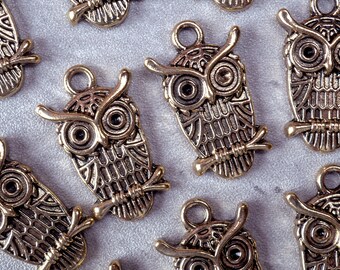 10 brass owl charms, single sided, owl on branch, with hanging loop.