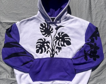 An XL plant themed hoodie made from thrifted materials.