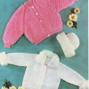 May include: Two knitted baby cardigans, one pink and one white, with a matching hat. The pink cardigan has a textured, fluffy design and button closure. The white cardigan features a fluffy collar and cuffs. Displayed on a teal background.