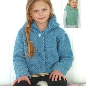 May include: A young girl wearing a light blue knitted hooded jacket with a large button closure. The jacket has a textured pattern down the front and around the hood. A smaller image shows a green knitted vest with a hood and button closure.