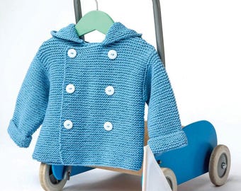 May include: A light blue knitted baby coat with a hood and white buttons hangs on a green hanger. The coat is displayed on a blue toy wagon with a small sailboat. The coat is made of a textured knit fabric.