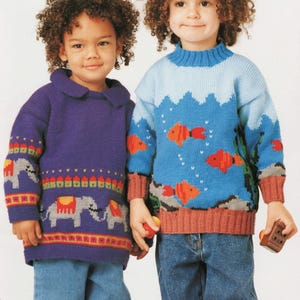 May include: Two children wearing knitted sweaters. One sweater is purple with elephant and geometric designs. The other is blue with an underwater scene, including orange fish and a mountain range. Both children are wearing blue jeans.
