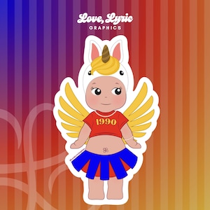 May include: A sticker featuring a cartoon baby dressed as a unicorn with yellow wings. The baby wears a red crop top with "1990" printed on it and a blue skirt. The sticker has the text "Love, Lyric GRAPHICS" in the top left corner.