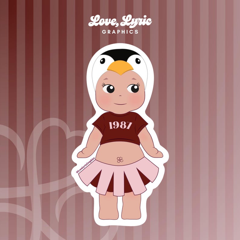 May include: A sticker featuring a cartoon baby wearing a penguin hat and a maroon crop top with the number "1987". The baby is also wearing a pink pleated skirt. The sticker has the text "Love, Lyric Graphics".