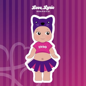 May include: A sticker featuring a cartoon baby wearing a purple cat-eared hat, a pink crop top with "1990" printed on it, and a purple and pink pleated skirt. The sticker has a white border and the text "Love, Lyric GRAPHICS" at the top.
