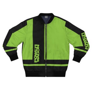 May include: A black and neon green bomber jacket with the text "POWER WAGON" printed on the front and sleeve. The jacket has a full-length zipper and black ribbed cuffs and hem. The jacket is a vibrant and eye-catching piece of apparel.
