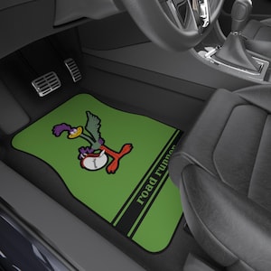 May include: Green car floor mat with a cartoon Road Runner graphic and the text "Road Runner".