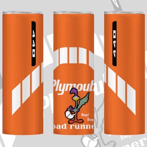 May include: Orange tumbler featuring a white graphic of a bridge and the words "Plymouth Road Runner". The tumbler also has a cartoon roadrunner character and the number "440" in a black rectangle. The tumbler has a white and orange design.