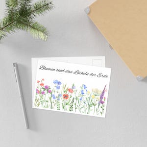 Ansichtkaart met bloemenspreuk