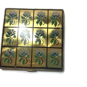 Rare Find vintage powder compact, enamel floral design. Mirrored inside. Contains  original puff and screen