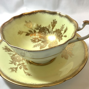PARAGON Fine Bone China Tea cup and Saucer yellow and gold Made in England