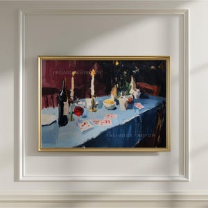 May include: A framed oil painting depicting a dining table covered with a light blue tablecloth. The scene features a dark wine bottle, a glass of red wine, lit candles, a small bowl, and scattered playing cards under dim lighting.