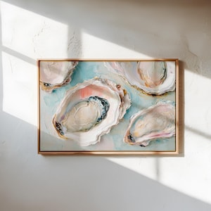 May include: An abstract painting of several open oyster shells with a light blue and pink background. The artwork is framed in a natural wood frame and is displayed against a white wall. The oyster shells have a textured, three-dimensional appearance.