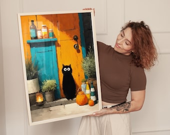May include: A framed art print featuring a whimsical illustration of a black cat standing in front of a colorful door. The door is painted in shades of orange and blue, with potted plants and decorative items adding to the scene. The cat has large, round eyes.