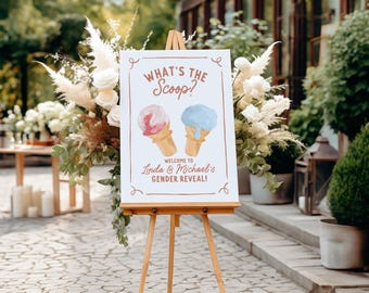 Könnte beinhalten: Eine Holzstaffelei zeigt ein Schild für eine Gender-Reveal-Party. Das Schild zeigt Eiswaffeln, eine rosa und eine blaue, mit dem Text "What's the Scoop?" und "Welcome to Linda & Michael's Gender Reveal!"