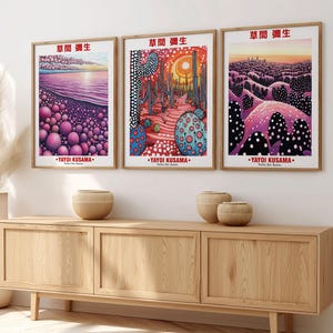 May include: Three framed art prints featuring colorful, abstract landscapes. Each print has a wooden frame and includes the text "草間彌生" and "YAYOI KUSAMA". The artwork depicts scenes with vibrant colors and dotted patterns.