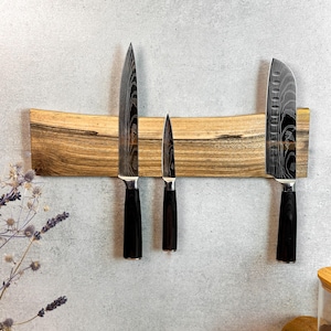 Walnut knife holder is a stylish and beautiful organizer in your kitchen. Wooden knife block with a live edge.
