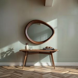 Both aesthetic and functional circular will be indispensable for your bedroom. 
The minimalist asymmetrical walnut mirror goes well with both classic and contemporary decor styles.